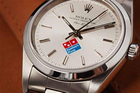 domino's logo rolex.